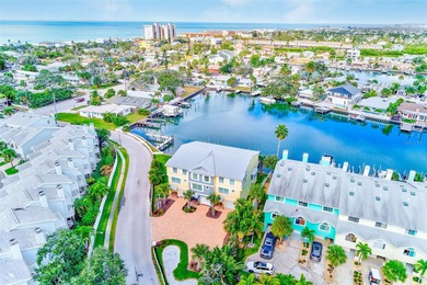 Stunning waterfront townhome just steps from the beach! Built in