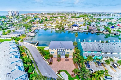 Stunning waterfront townhome just steps from the beach! Built in