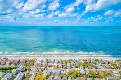 Stunning waterfront townhome just steps from the beach! Built in
