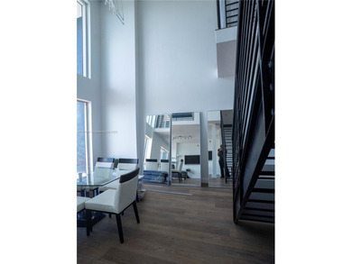 Experience luxury living high above the city in this stunning