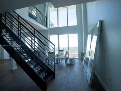 Experience luxury living high above the city in this stunning