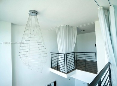 Experience luxury living high above the city in this stunning