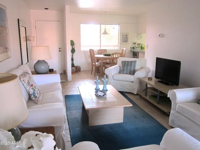 Step into this open and bright condo that blends warmth and