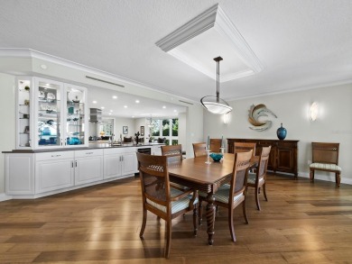 This exceptional 3-bedroom, 3.5-bathroom + family room residence