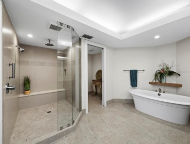 This exceptional 3-bedroom, 3.5-bathroom + family room residence