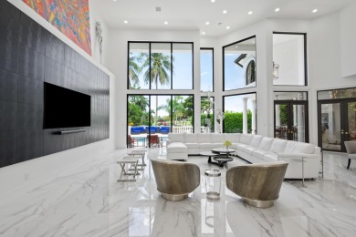 Experience breathtaking long lake views from this grand estate