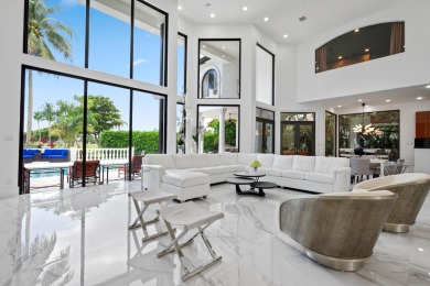 Experience breathtaking long lake views from this grand estate