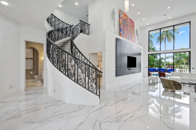 Experience breathtaking long lake views from this grand estate