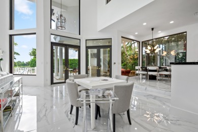 Experience breathtaking long lake views from this grand estate