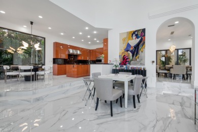 Experience breathtaking long lake views from this grand estate