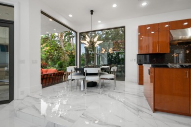 Experience breathtaking long lake views from this grand estate