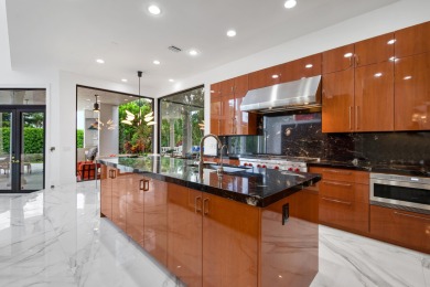 Experience breathtaking long lake views from this grand estate