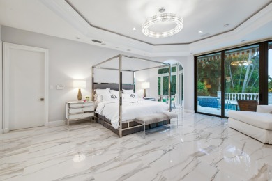 Experience breathtaking long lake views from this grand estate