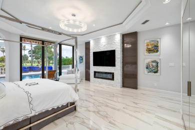 Experience breathtaking long lake views from this grand estate