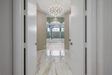 Experience breathtaking long lake views from this grand estate