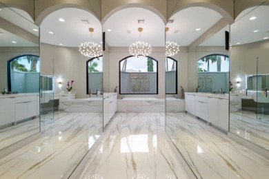 Experience breathtaking long lake views from this grand estate