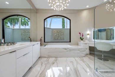 Experience breathtaking long lake views from this grand estate