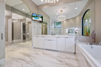 Experience breathtaking long lake views from this grand estate