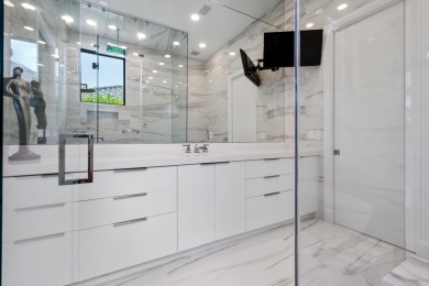 Experience breathtaking long lake views from this grand estate