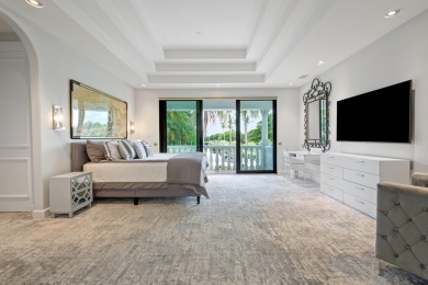 Experience breathtaking long lake views from this grand estate