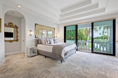 Experience breathtaking long lake views from this grand estate