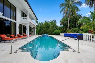 Experience breathtaking long lake views from this grand estate