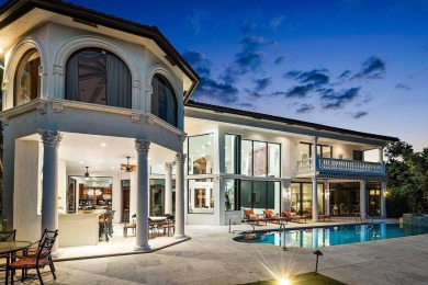 Experience breathtaking long lake views from this grand estate