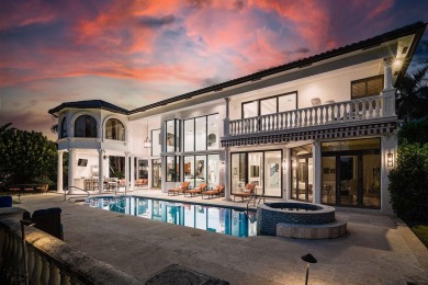 Experience breathtaking long lake views from this grand estate
