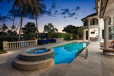Experience breathtaking long lake views from this grand estate