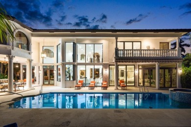 Experience breathtaking long lake views from this grand estate