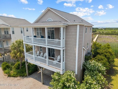 This meticulously maintained four-bedroom, three-bath waterfront