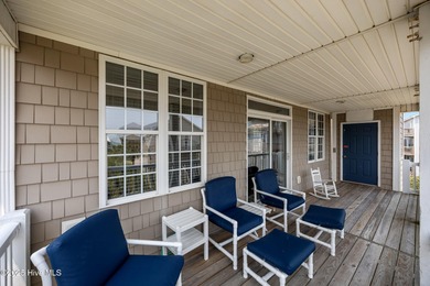 This meticulously maintained four-bedroom, three-bath waterfront