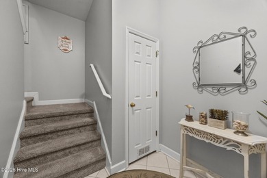 This meticulously maintained four-bedroom, three-bath waterfront