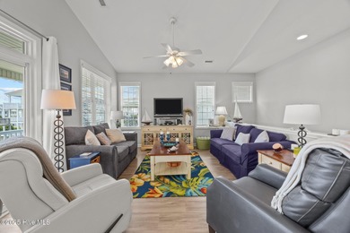 This meticulously maintained four-bedroom, three-bath waterfront