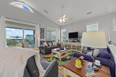 This meticulously maintained four-bedroom, three-bath waterfront