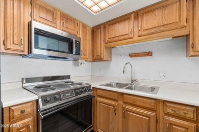 This delightful ground-floor condo offers convenience and