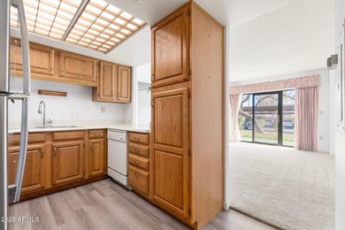 This delightful ground-floor condo offers convenience and