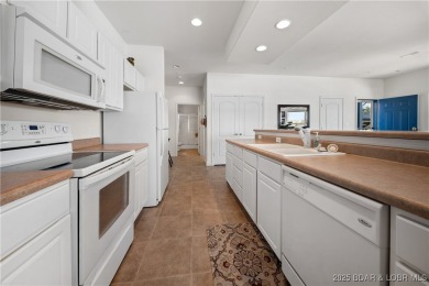 Experience lake living at its finest with this beautifully