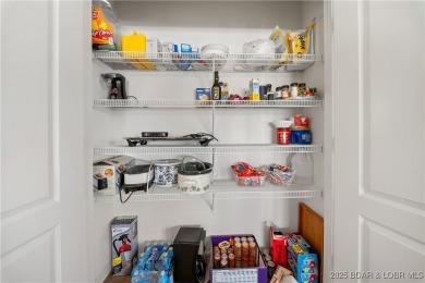 Experience lake living at its finest with this beautifully