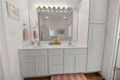 Experience lake living at its finest with this beautifully