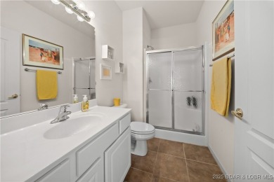 Experience lake living at its finest with this beautifully