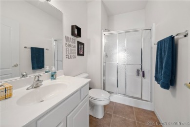 Experience lake living at its finest with this beautifully