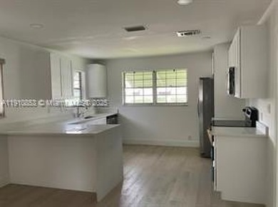 Totally remodeled 2/2 villa in a desirable 55+ community! Very