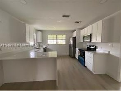 Totally remodeled 2/2 villa in a desirable 55+ community! Very