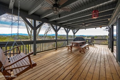 A beautiful lakefront home boasting mountain views, a boat dock