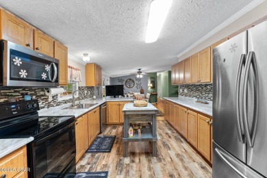 Nestled at the end of a quiet paved cul-de-sac, this spacious