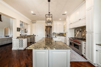 This elegant Spanish Mediterranean residence captures the heart