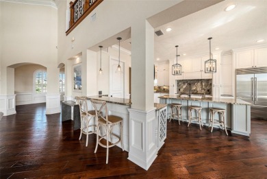 This elegant Spanish Mediterranean residence captures the heart