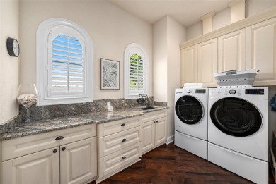 This elegant Spanish Mediterranean residence captures the heart