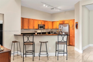 Discover this rare 2-bedroom, 2-bath plus den residence at The